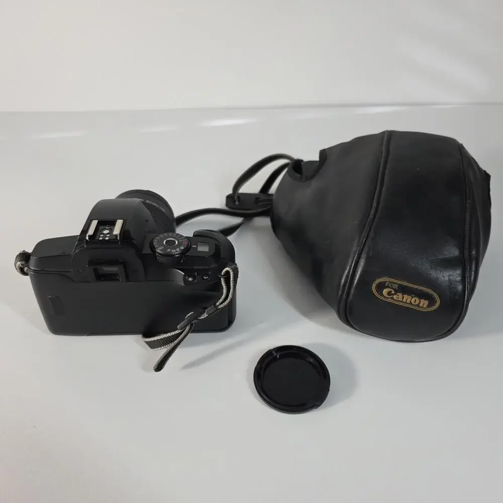 Canon EOS 5000 with 38-76mm EF zoom, UV filter, strap